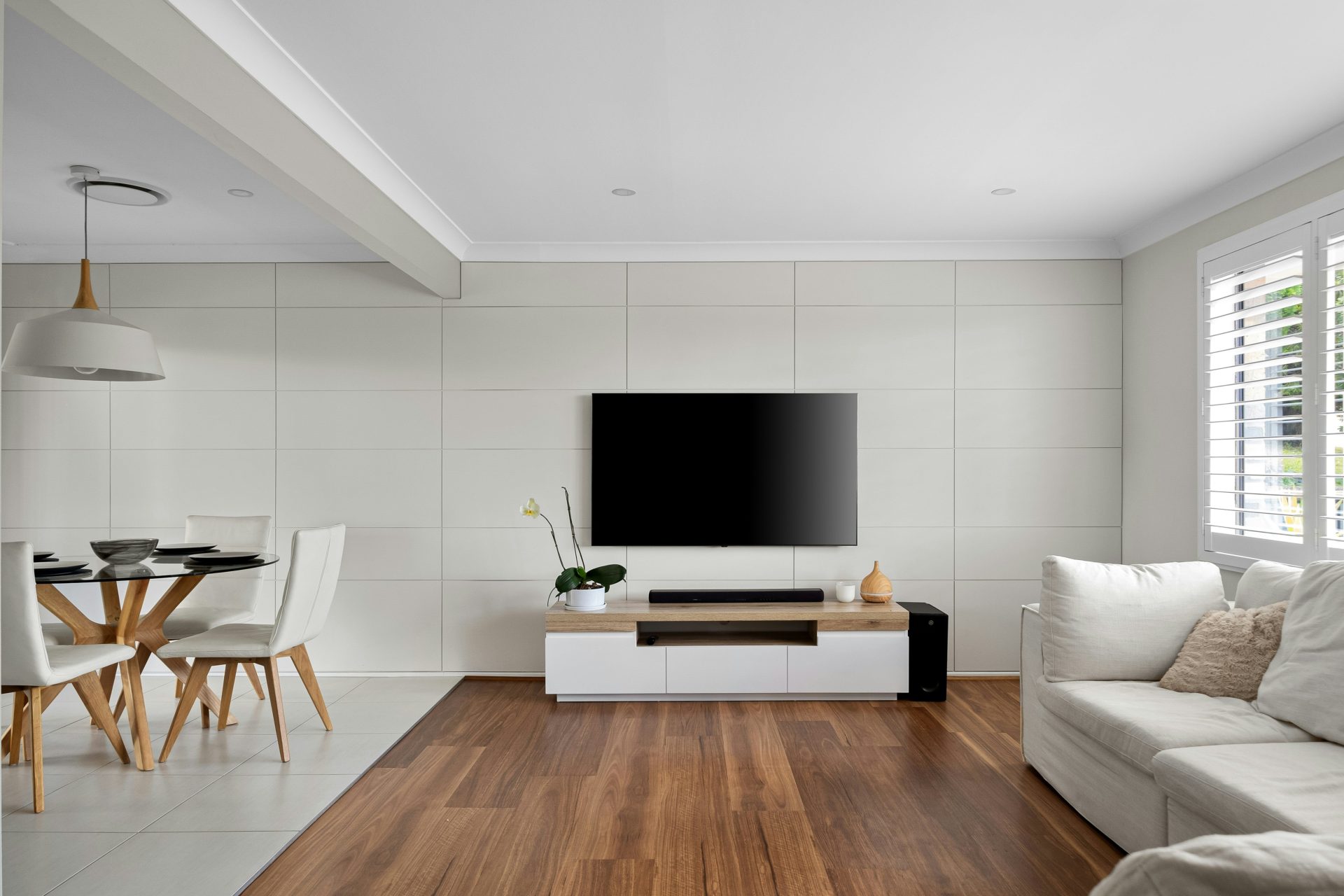 A living room filled with furniture and a flat screen TV